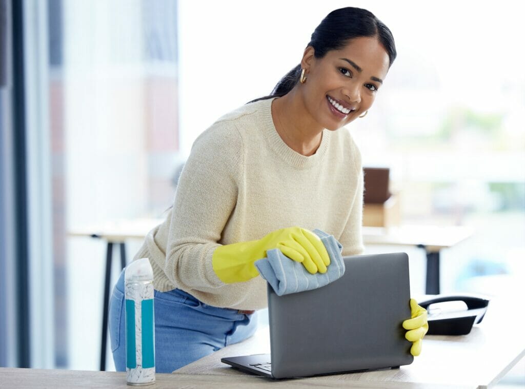 Office, cleaning service and woman in portrait with product, cloth, spray bottle and laptop dust fo